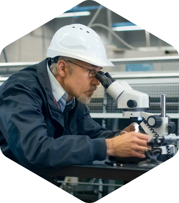 Man examines a building material in the laboratory